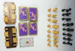 Staunton style carved wooden chess set, height of king 7cm, together with a Bezique card game set