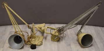 Two anglepoise or similar industrial style work lamps, one with base the other for wall mounting,