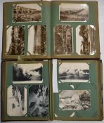 Approximately 280 cards in two Edwardian postcard albums to include Torquay, River Dart, Babbacombe,
