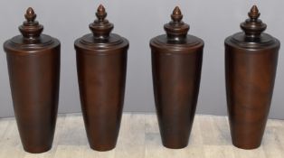 Four turned hardwood covered urns, H60cm
