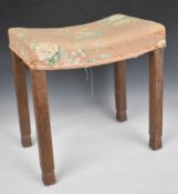 King George VI upholstered Coronation stool with bevelled limed oak frame, metal brackets under,