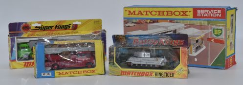 Four Matchbox diecast model vehicles and accessories Super Kings Cargo Hauler and Pallet Loader K-