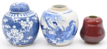 Three Chinese ginger jars comprising blue and white with prunus decoration, similar example
