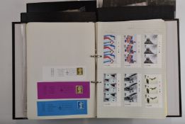 An extensive collection of mint GB stamps in five ring binders covering 1980 to 2013, mostly in