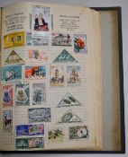 The Ace Herald stamp album containing a collection of GB and world stamps.