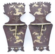 A pair of Japanese Meiji period lacquer wall brackets with folding shelves and gilt decoration