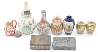 A collection of oriental ceramics and metal ware comprising a pair of Japanese Satsuma vases
