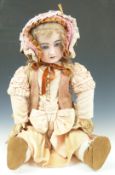 Jumeau style bisque headed doll with fixed blue eyes, pierced ears, open mouth, blonde hair and