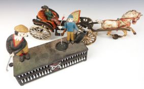 Novelty cast iron golfing 'Birdie Putt' money box and a similar model horse and carriage.