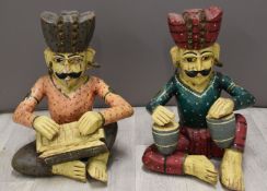 Two novelty carved seated figures, H38cm
