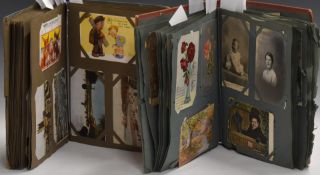 Two Edwardian postcard albums with humorous, topographical, military, Gloucestershire cards to