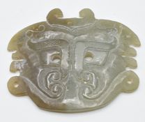 Chinese 19thC jade archaic pendant depicting a stylised Fu dog, 7 x 5.8cm