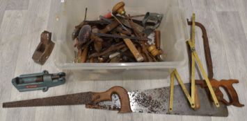 Vintage woodworking tools including saws, plane etc