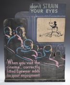 Disney interest vintage optician's shop display with heading 'don't strain your eyes' and text below