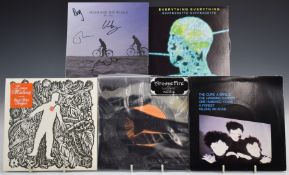 Approximately 35 singles from late 1970s to 2000s including The Cure, Laura Marling, Arcade Fire