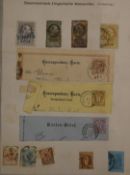 An old German illustrated stamp album containing a GB and world stamps collection (with a few postal