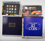 A collection of GB yearbooks and mint postage stamps, prestige booklets etc