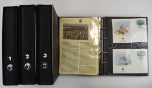 Four albums of WWF stamp covers and a Stanley Gibbons Royal Wedding album for Princess Anne and