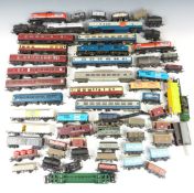 A collection of Hornby, Tri-ang, Lima and similar 00 gauge model railway coaches, vans, wagons and