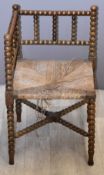 Bobbin turned corner chair with cane seat, H66cm