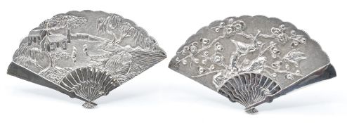 Two Chinese white metal fan shaped menu holders with easel backs with embossed prunus and bird