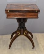 Victorian inlaid rosewood fold out card table with column supports, raised on four outswept legs and