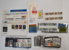 A quantity of mint GB stamps on stockcards, booklets, Bahrain first day covers etc