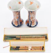 A pair of Japanese Imari vases, 16cm tall and two sets of bamboo Chinese paint brushes with engraved