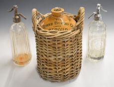 Stroud Brewery Company vintage stoneware flagon in wicker holder and two soda syphons, tallest 28cm