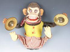 Japanese battery operated tinplate and felt model monkey playing the cymbals, 28cm tall.