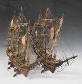 Two wooden models of a three masted sailing ships, largest 64cm tall.