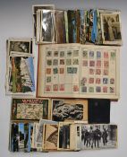 Lincoln all world stamp album, a similar collection of postcards and a leather wallet with
