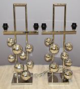 A pair of designer chrome 'bubble' lamp bases, H75cm