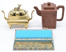 Chinese brass censer with dog finial together with a Yixing teapot of square form decorated with