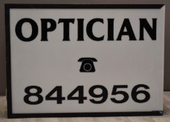 Optician's shop illuminated two sided advertising sign, W87 x D18 x H62cm