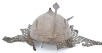Indian Mughal metal helmet with chain mail neck guard and all over relief moulded decoration of