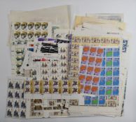 A large quantity of loose mint GB QEII stamps, includes many blocks, half and whole sheets, high