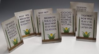Set of seven vintage optician's advertising Art Deco slogan boards, each made from card with easel