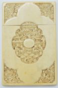 Chinese 19thC ivory card case with carving depicting a village scene to the centre and floral
