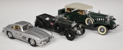 Three Franklin Mint diecast model vehicles comprising The 1932 Cadillac V-16 Sport Phaeton, 1929
