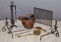 Fireside accessories including copper coal scuttle, companion set, guard and andirons