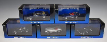 Five Autoart 1:43 scale diecast model Jaguar sports cars, all in original display boxes.