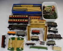 A collection of Hornby Dublo 00 gauge model railway locomotives, coaches, buildings and