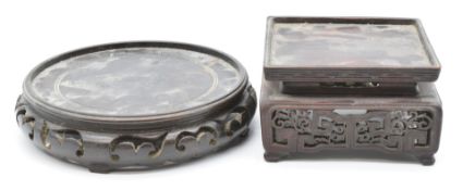 Two Chinese hardwood stands with carved decoration, the 19thC square example to suit a vase 11.5 x