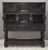 Elizabeth I / Tudor jointed oak and parquetry inlaid figurally decorated canted court cupboard,