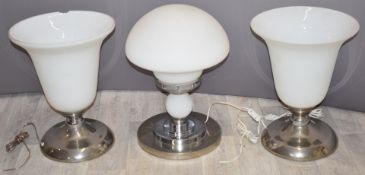 A pair of electric uplighter table lamps and an Art Deco dome shaped opaque glass lamp, tallest