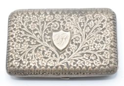 Indian or similar silver cigarette case with embossed foliate and floral decoration, L8cm, weight