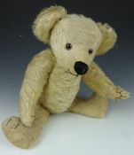 Steiff style Teddy bear with blonde mohair, stitched snout and pads, glass eyes and jointed limbs,
