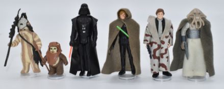 Six Kenner Star Wars figures including Darth Vader, Luke Skywalker Jedi Knight Outfit, Wicket,