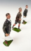 Three Britains Famous Football Series lead models comprising a referee and two linesmen.